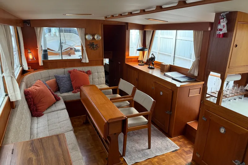  Yacht Photos Pics Interior of 1981 Grand Banks 42 Classic yacht with cozy seating and wooden furnishings.