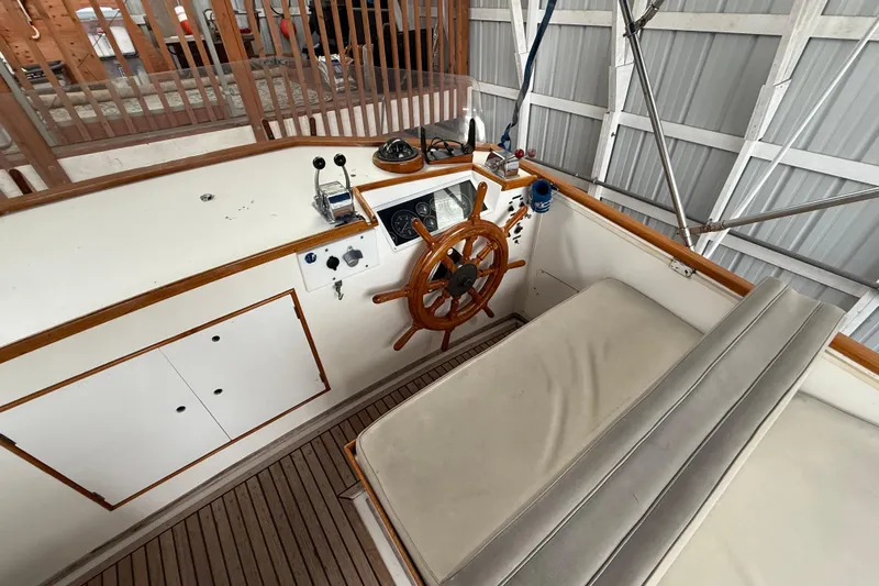  Yacht Photos Pics 1981 Grand Banks 42 Classic helm with wooden wheel and control panel.