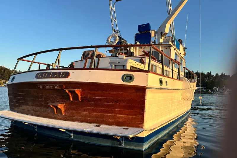  Yacht Photos Pics 1981 Grand Banks Classic Tri-cabin boat docked in Gig Harbor, WA, at sunset.