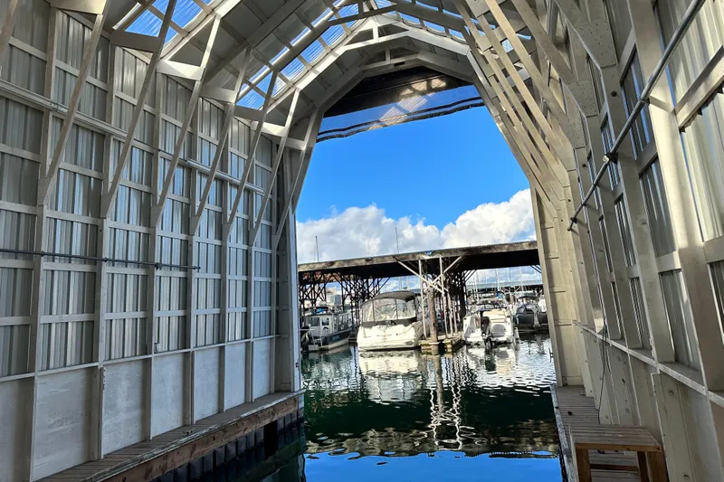  Yacht Photos Pics Covered marina with boats, featuring a 1981 Grand Banks Classic Tri-cabin.