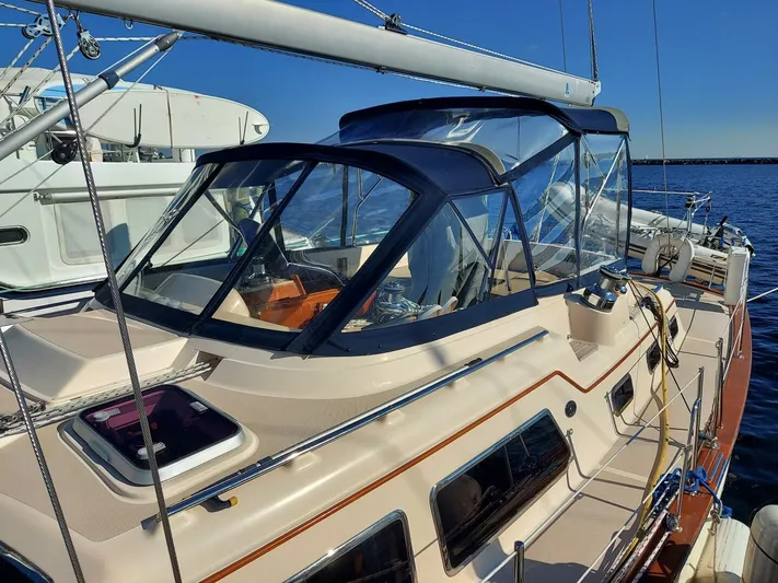  Yacht Photos Pics 2009 Island Packet 465 sailboat with sleek design, docked in a marina.