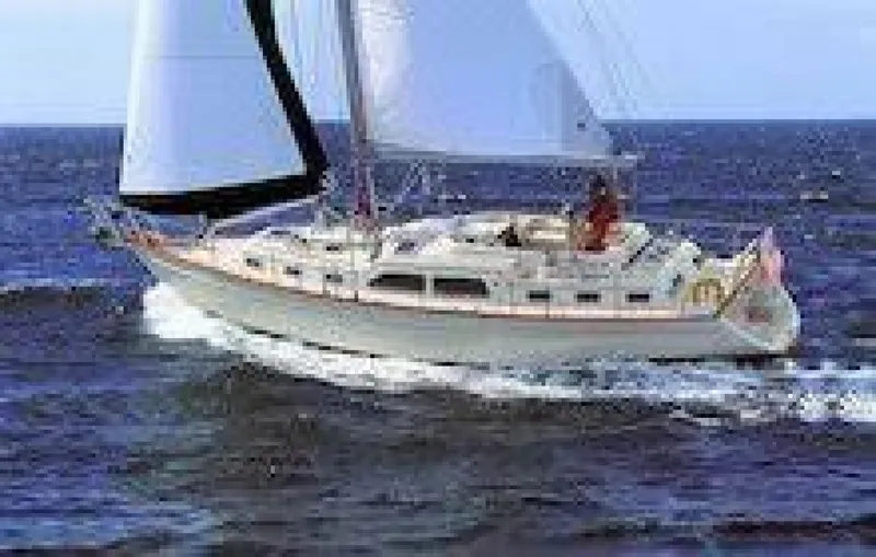  Yacht Photos Pics Sailing yacht Island Packet 465, 2009 model, cruising on open sea.