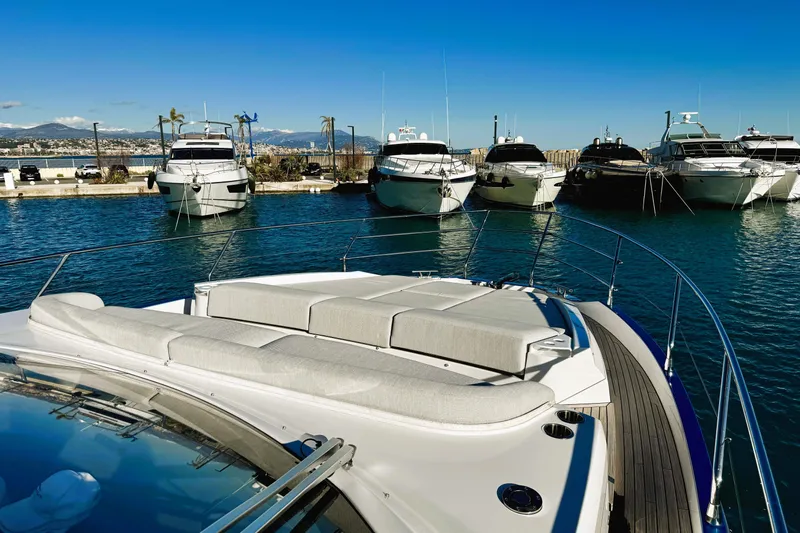  Yacht Photos Pics 2024 Azimut Fly 53 yacht docked in a sunny marina with clear blue skies.