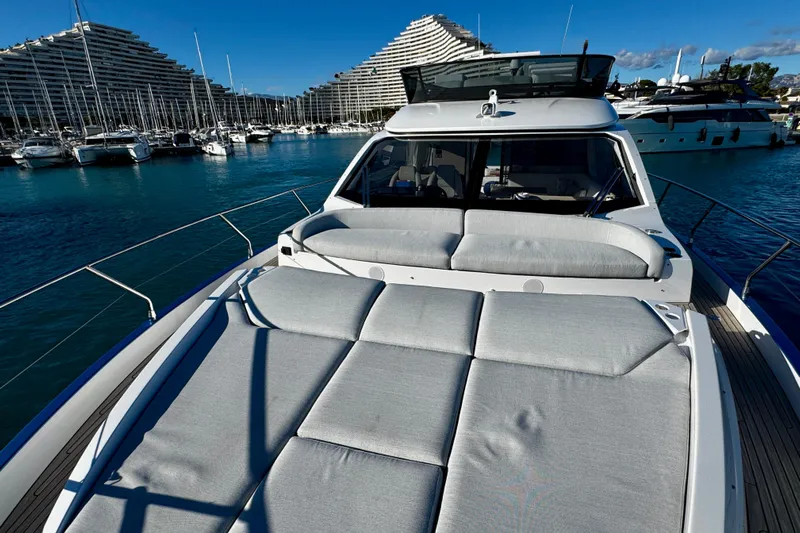  Yacht Photos Pics 2024 Azimut Fly 53 yacht with sunbathing area, docked in a marina.