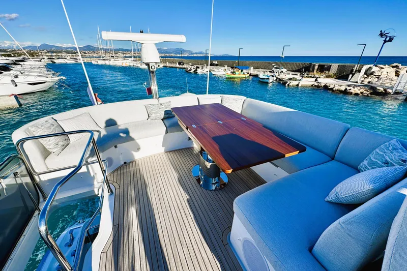  Yacht Photos Pics Luxurious 2024 Azimut Fly 53 yacht deck with elegant seating and ocean view.