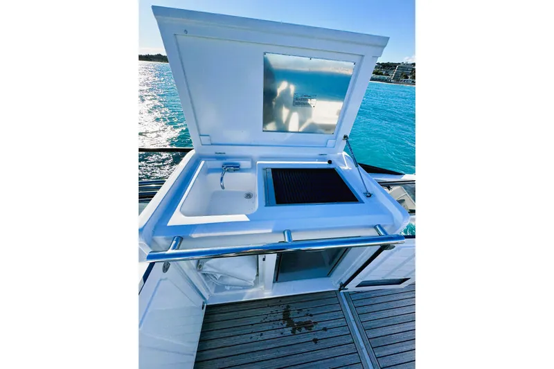  Yacht Photos Pics Outdoor kitchen on 2024 Azimut Fly 53 yacht with sink and grill, overlooking ocean.