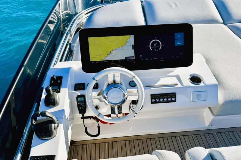  Yacht Photos Pics 2024 Azimut Fly 53 yacht helm with modern navigation display and controls.