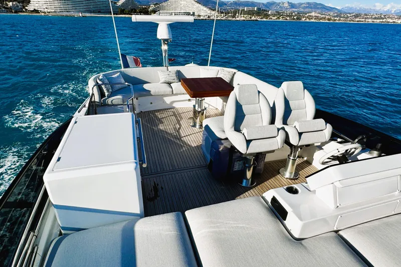  Yacht Photos Pics Luxurious 2024 Azimut Fly 53 yacht deck with seating, table, and ocean view.