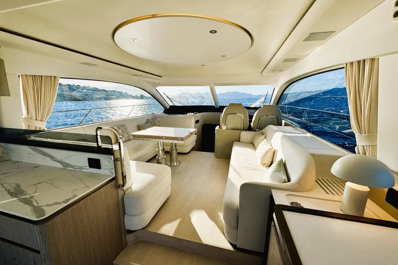  Yacht Photos Pics Luxurious interior of 2024 Azimut Fly 53 yacht with elegant seating and panoramic windows.
