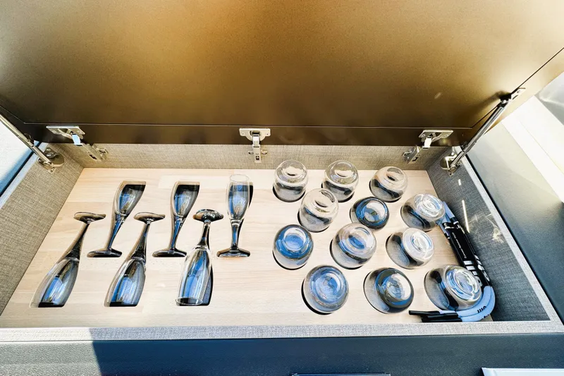  Yacht Photos Pics Luxury yacht Azimut Fly 53, 2024, glassware storage compartment with champagne and cocktail glasses.