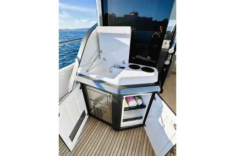  Yacht Photos Pics Outdoor kitchenette on 2024 Azimut Fly 53 yacht with sink and storage.