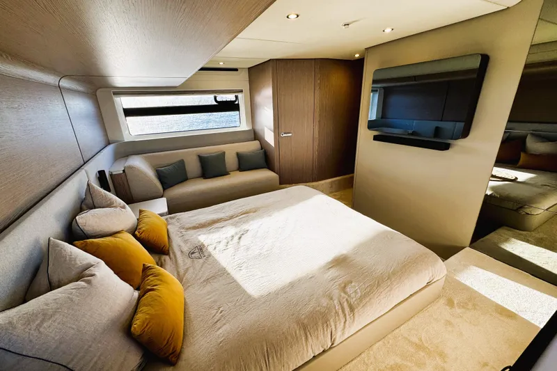  Yacht Photos Pics Luxurious bedroom interior of 2024 Azimut Fly 53 yacht with modern design and cozy bedding.