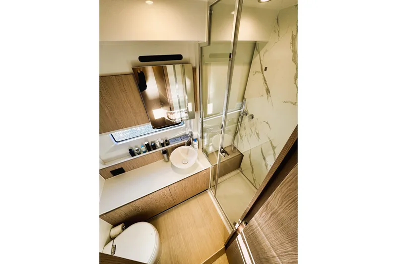  Yacht Photos Pics Luxurious bathroom in 2024 Azimut Fly 53 yacht with modern fixtures and elegant design.