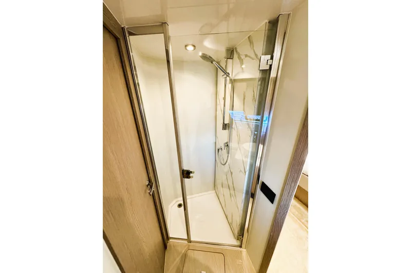  Yacht Photos Pics Luxurious shower in 2024 Azimut Fly 53 yacht, featuring sleek glass doors and modern fixtures.
