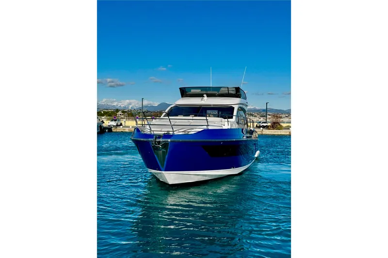  Yacht Photos Pics 2024 Azimut Fly 53 yacht on clear blue water, front view.