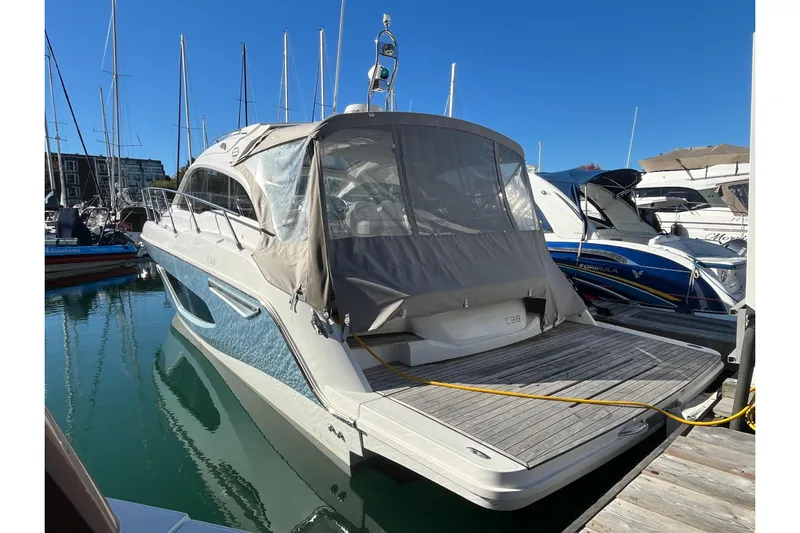  Yacht Photos Pics 2024 Sessa Marine C38 yacht docked at marina under clear blue sky.