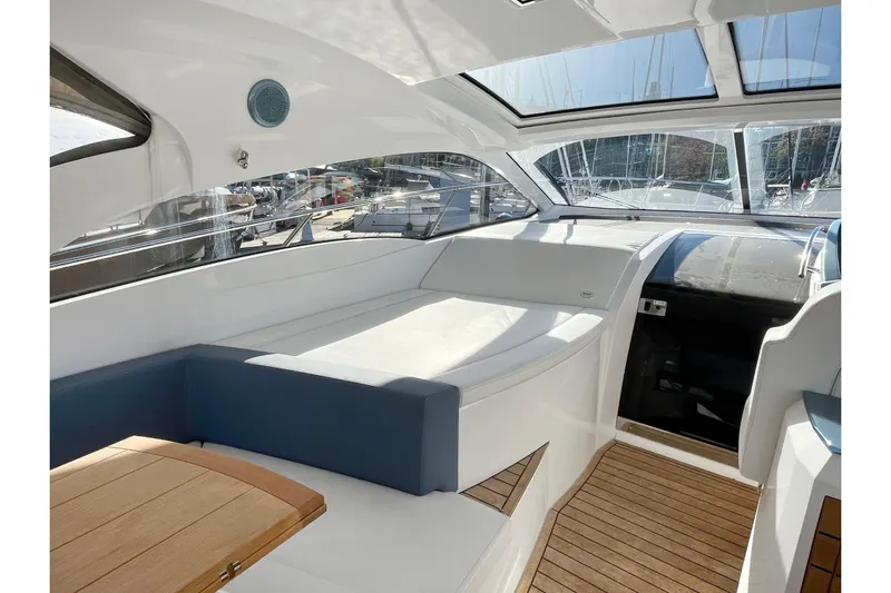  Yacht Photos Pics 2024 Sessa Marine C38 yacht interior with sleek design and wooden flooring.