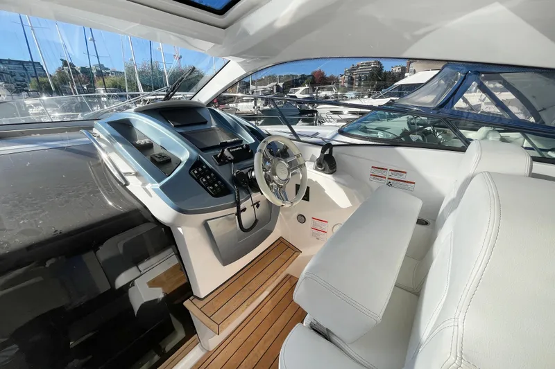  Yacht Photos Pics 2024 Sessa Marine C38 yacht cockpit with modern controls and white seating.