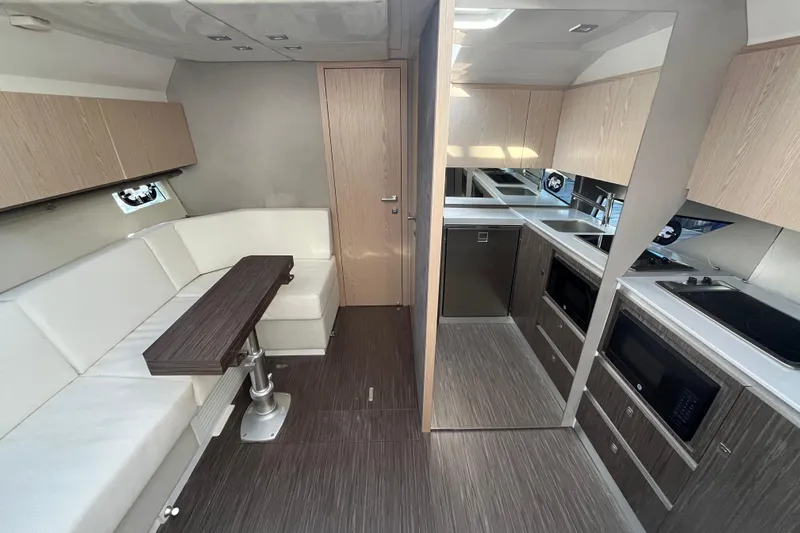  Yacht Photos Pics 2024 Sessa Marine C38 yacht interior with modern kitchen and seating area.