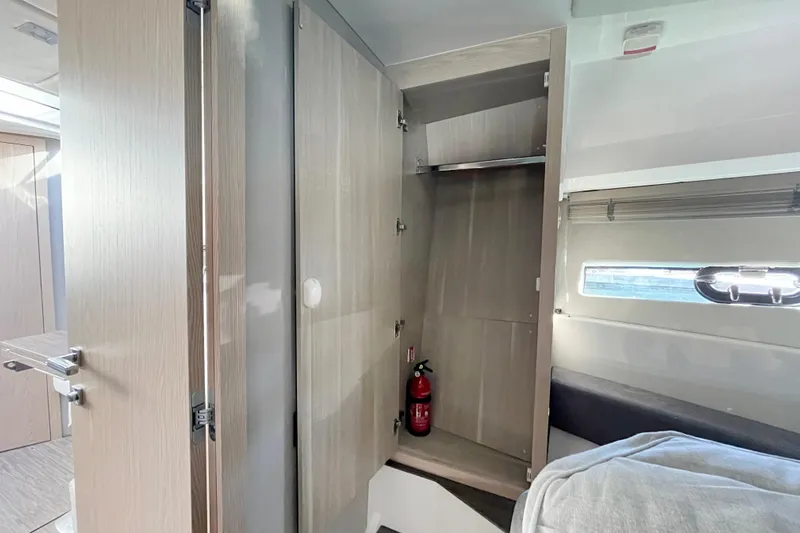  Yacht Photos Pics 2024 Sessa Marine C38 interior with open closet and fire extinguisher.