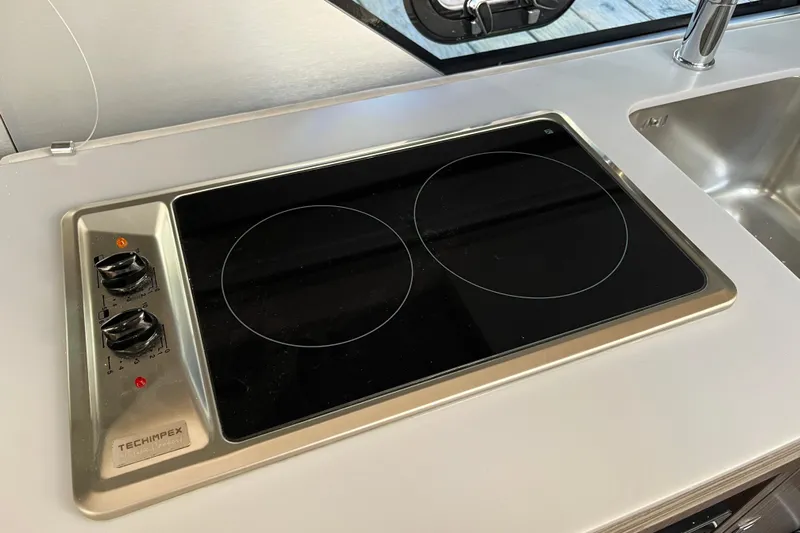  Yacht Photos Pics Modern stovetop on 2024 Sessa Marine C38 yacht kitchen counter.