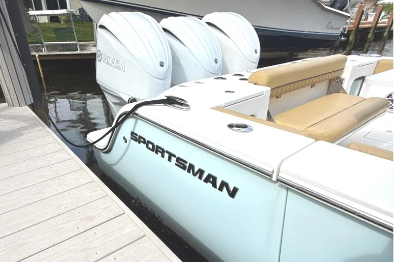 Scungilli Yacht Photos Pics 2023 Sportsman Open 352 Center Console docked, featuring Yamaha engines and tan seating.