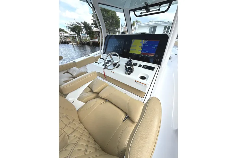 Scungilli Yacht Photos Pics 2023 Sportsman Open 352 Center Console helm with advanced navigation displays and luxurious seating.