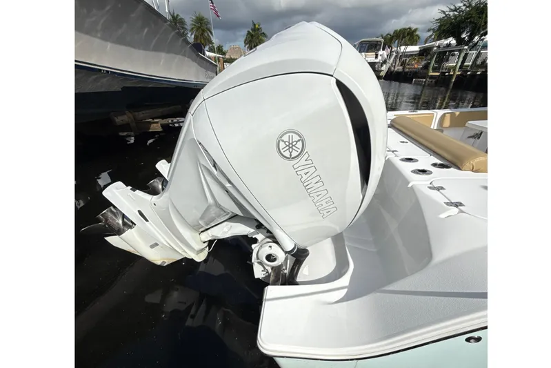 Scungilli Yacht Photos Pics 2023 Sportsman Open 352 Center Console with Yamaha outboard motor, docked by the water.