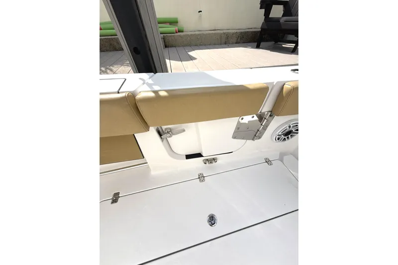 Scungilli Yacht Photos Pics 2023 Sportsman Open 352 Center Console boat interior with tan seating and speaker.