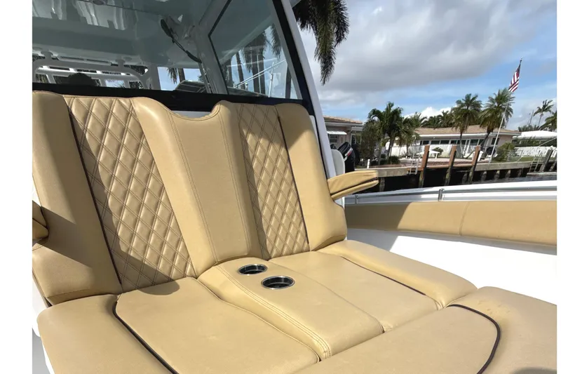 Scungilli Yacht Photos Pics 2023 Sportsman Open 352 Center Console boat with tan quilted seating and cup holders.