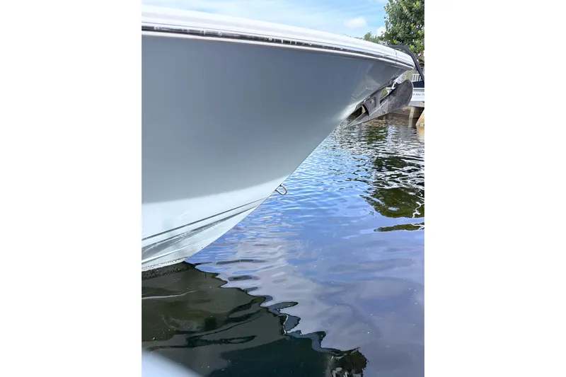 Scungilli Yacht Photos Pics 2023 Sportsman Open 352 Center Console boat bow on calm water.