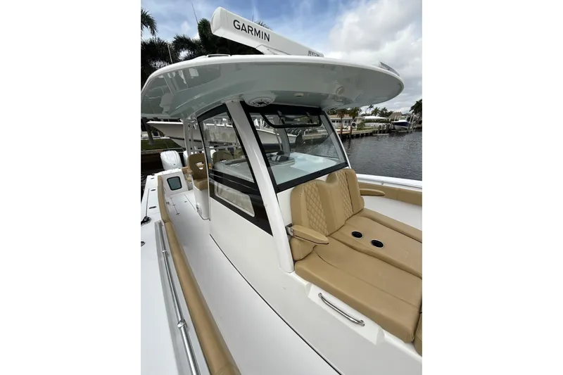 Scungilli Yacht Photos Pics 2023 Sportsman Open 352 Center Console boat with tan seating and Garmin equipment.