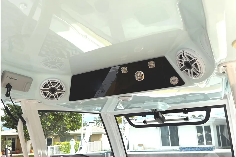 Scungilli Yacht Photos Pics 2023 Sportsman Open 352 Center Console interior with speakers and Garmin equipment.