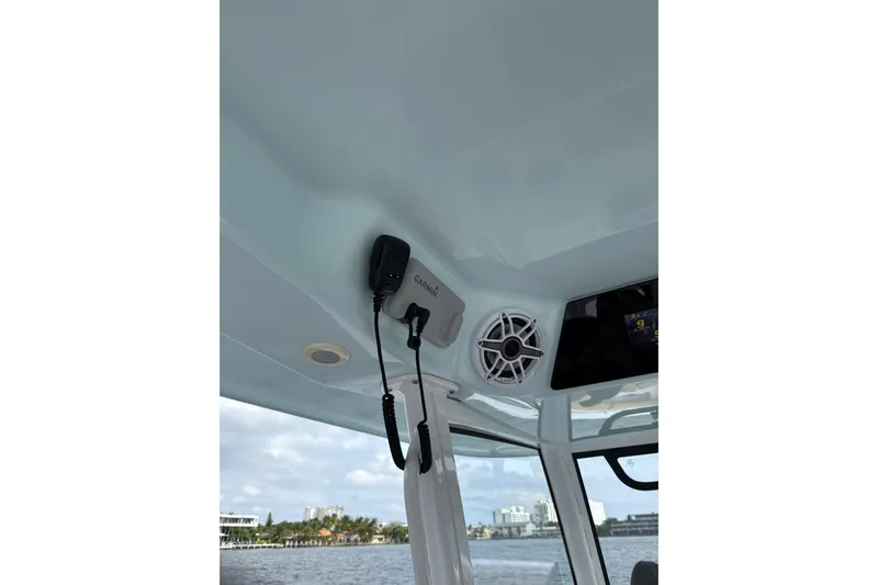 Scungilli Yacht Photos Pics 2023 Sportsman Open 352 Center Console interior with Garmin device and speaker.