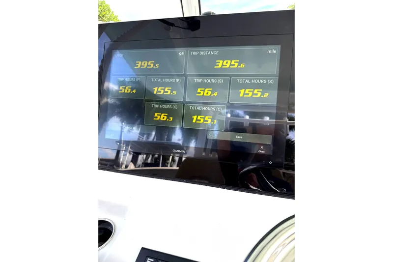 Scungilli Yacht Photos Pics 2023 Sportsman Open 352 Center Console dashboard displaying trip data and fuel usage.