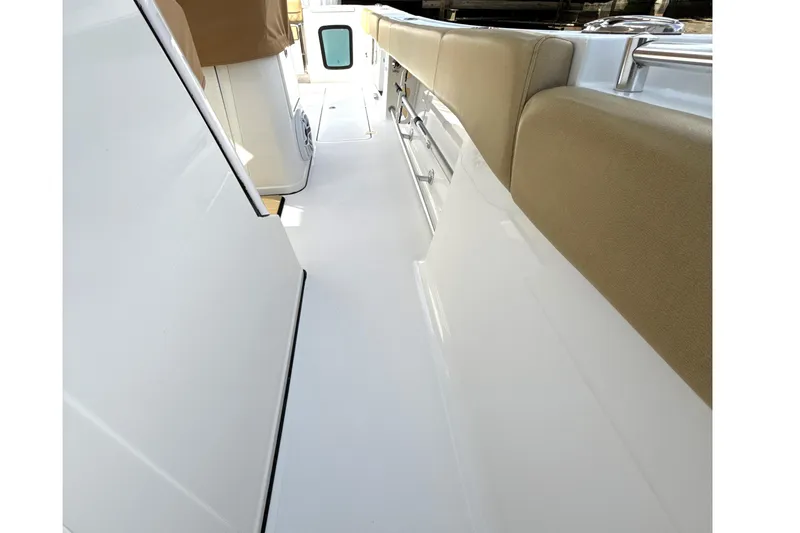 Scungilli Yacht Photos Pics 2023 Sportsman Open 352 Center Console interior with beige seating and sleek white design.