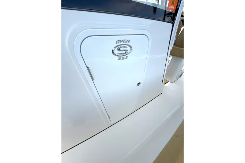 Scungilli Yacht Photos Pics 2023 Sportsman Open 352 Center Console boat door with logo detail.