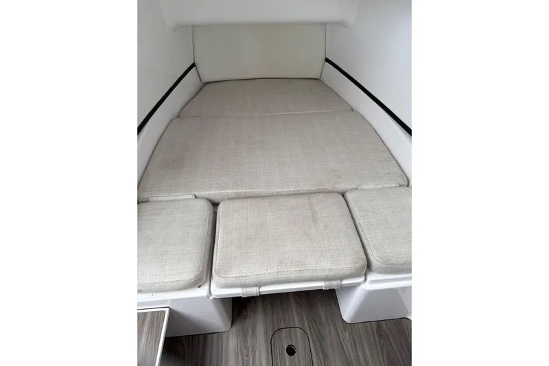 Scungilli Yacht Photos Pics 2023 Sportsman Open 352 Center Console cabin interior with cushioned seating.