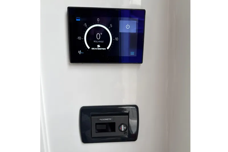 Scungilli Yacht Photos Pics 2023 Sportsman Open 352 Center Console control panel with Seakeeper and Dometic displays.