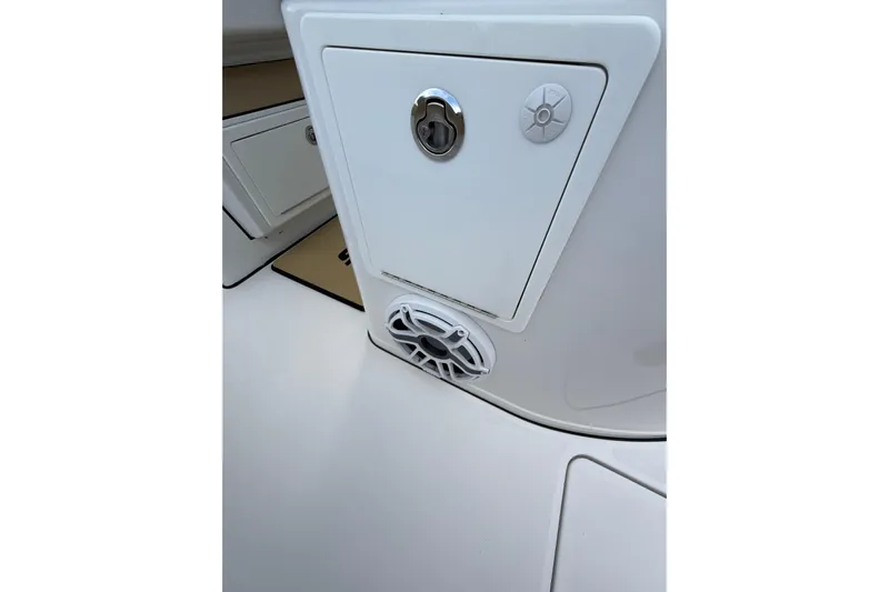 Scungilli Yacht Photos Pics 2023 Sportsman Open 352 Center Console boat interior detail with speaker and storage compartment.