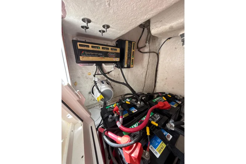 Scungilli Yacht Photos Pics 2023 Sportsman Open 352 Center Console battery compartment with charger and wiring.