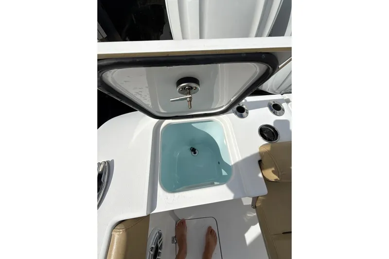 Scungilli Yacht Photos Pics 2023 Sportsman Open 352 Center Console boat interior with open hatch and seating.