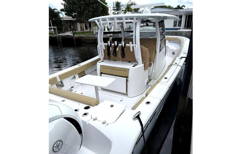 Scungilli Yacht Photos Pics 2023 Sportsman Open 352 Center Console boat docked, featuring spacious seating and modern design.