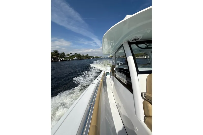Scungilli Yacht Photos Pics 2023 Sportsman Open 352 Center Console cruising on a sunny day.