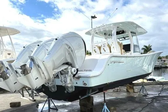 Scungilli Yacht Photos Pics 2023 Sportsman Open 352 Center Console boat with dual engines on display.