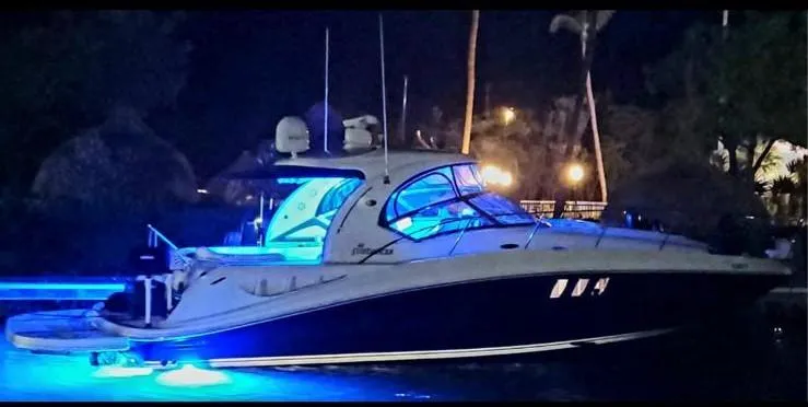  Yacht Photos Pics 2008 Sea Ray 40 Sundancer yacht illuminated with blue lights at night.