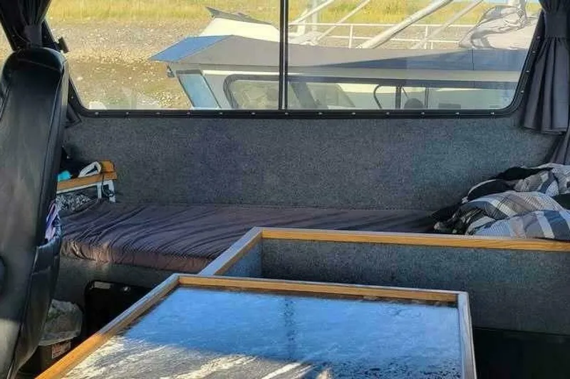 Alliance Yacht Photos Pics Interior of 2022 Custom Freestyle Marine 32 boat with seating and table.