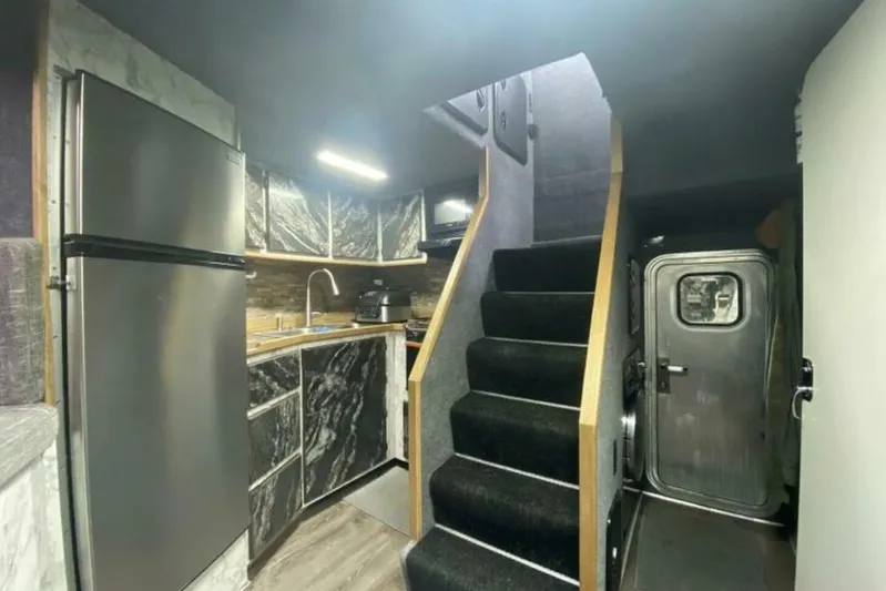 Alliance Yacht Photos Pics Modern kitchen interior in 2022 Custom Freestyle Marine 32 boat, featuring sleek design and stainless steel appliances.