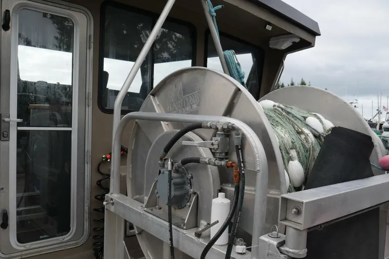 Alliance Yacht Photos Pics Fishing equipment on a 2022 Custom Freestyle Marine 32 boat, featuring netting and winch.