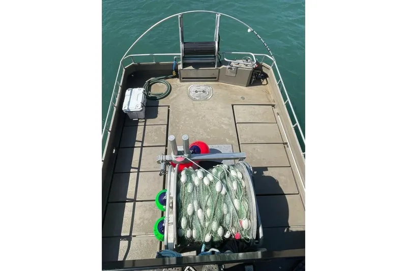 Alliance Yacht Photos Pics Custom Freestyle Marine 32 boat deck with fishing gear, 2022 model, on calm water.